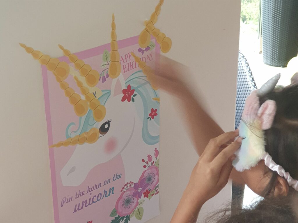 Pin the horn on the unicorm game unicorn party activity